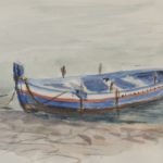 An old wooden fisherman's boat floats on the sea